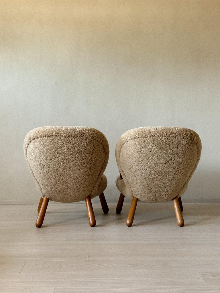 Back view of Clam Chairs showing wooden frame curvature