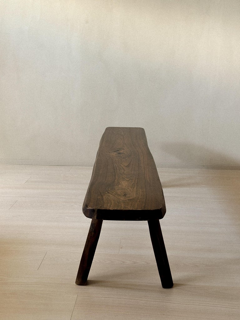 Front view of dark oak brutalist bench from France