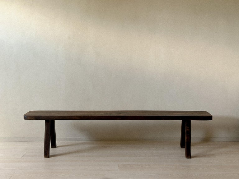 Side view of brutalist bench with thick oak construction