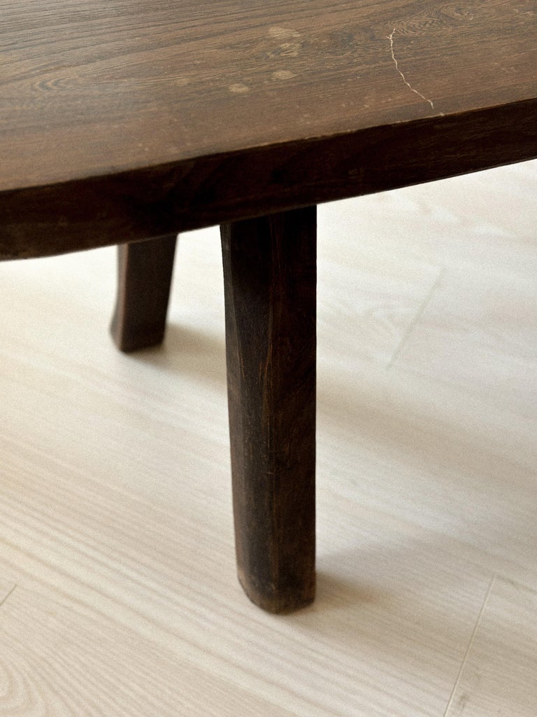 Dark oak bench with thick proportions and natural form
