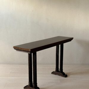 Side profile of vintage Spanish console with carved details