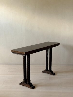 Side profile of vintage Spanish console with carved details