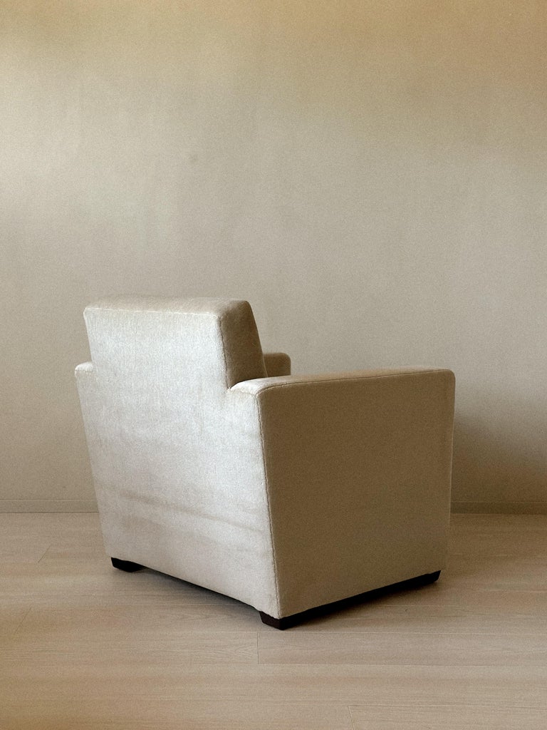 Compact Danish club chair in understated upholstery