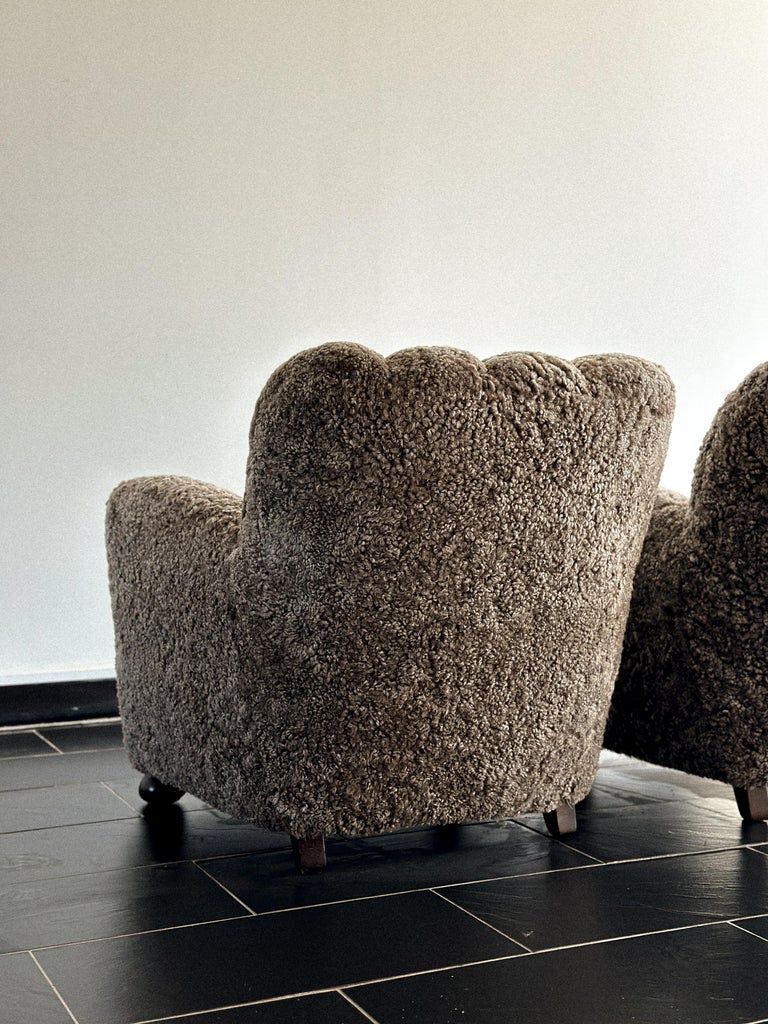 Side view of danish design chairs in brown sheepskin