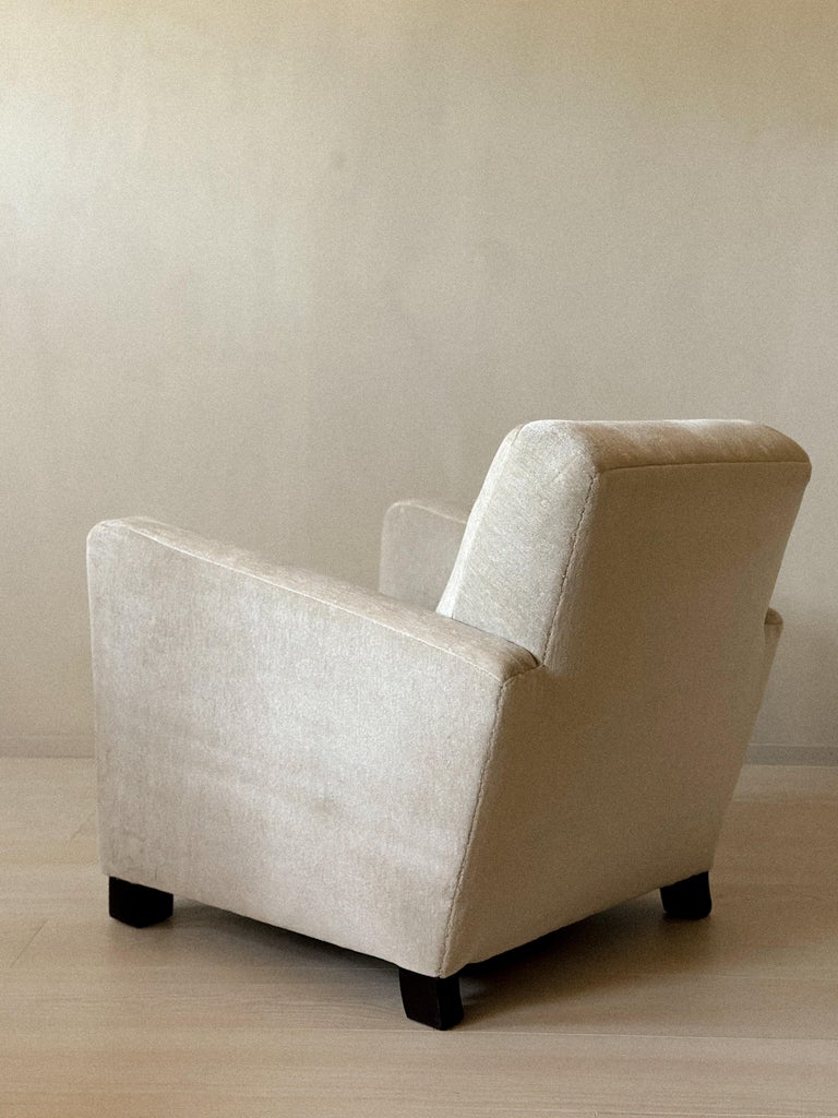 Low vintage club chair in neutral tone fabric