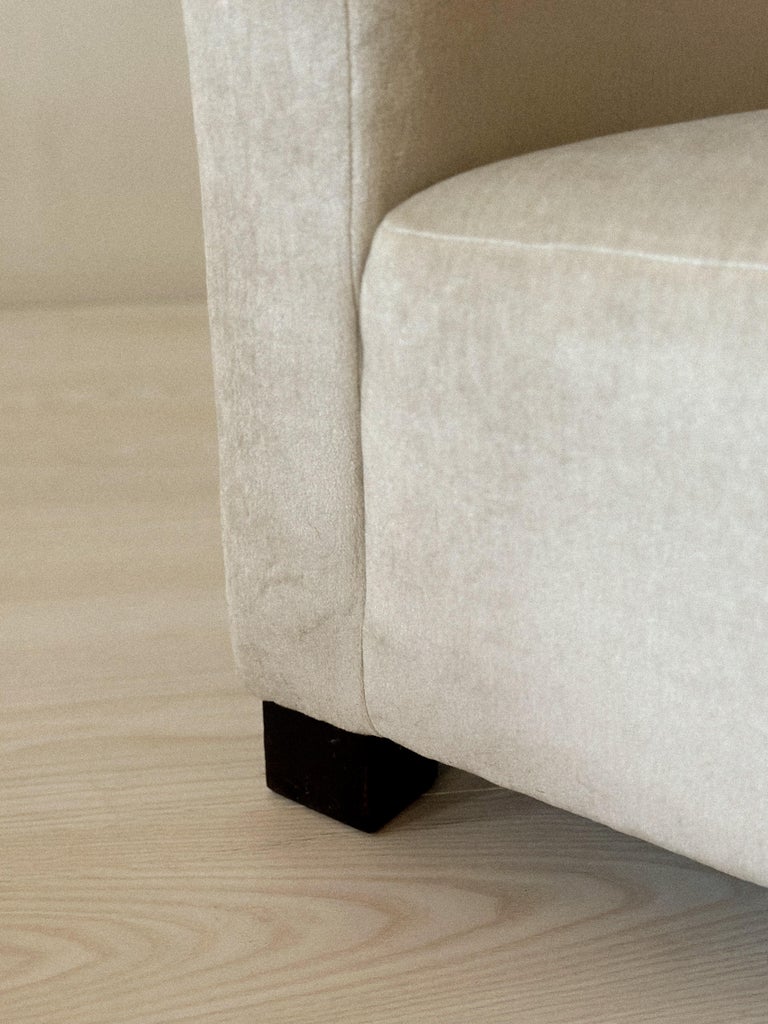 Close-up of wooden block feet on Danish club chair