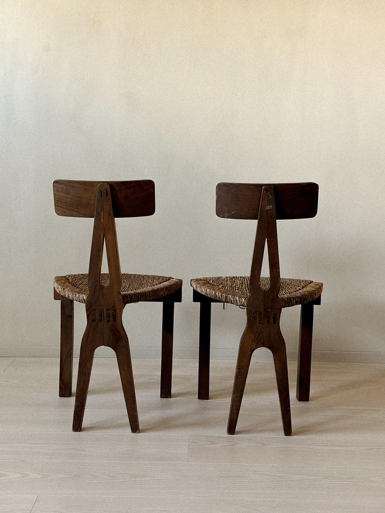 Back view of sculpted wooden chairs from Spain