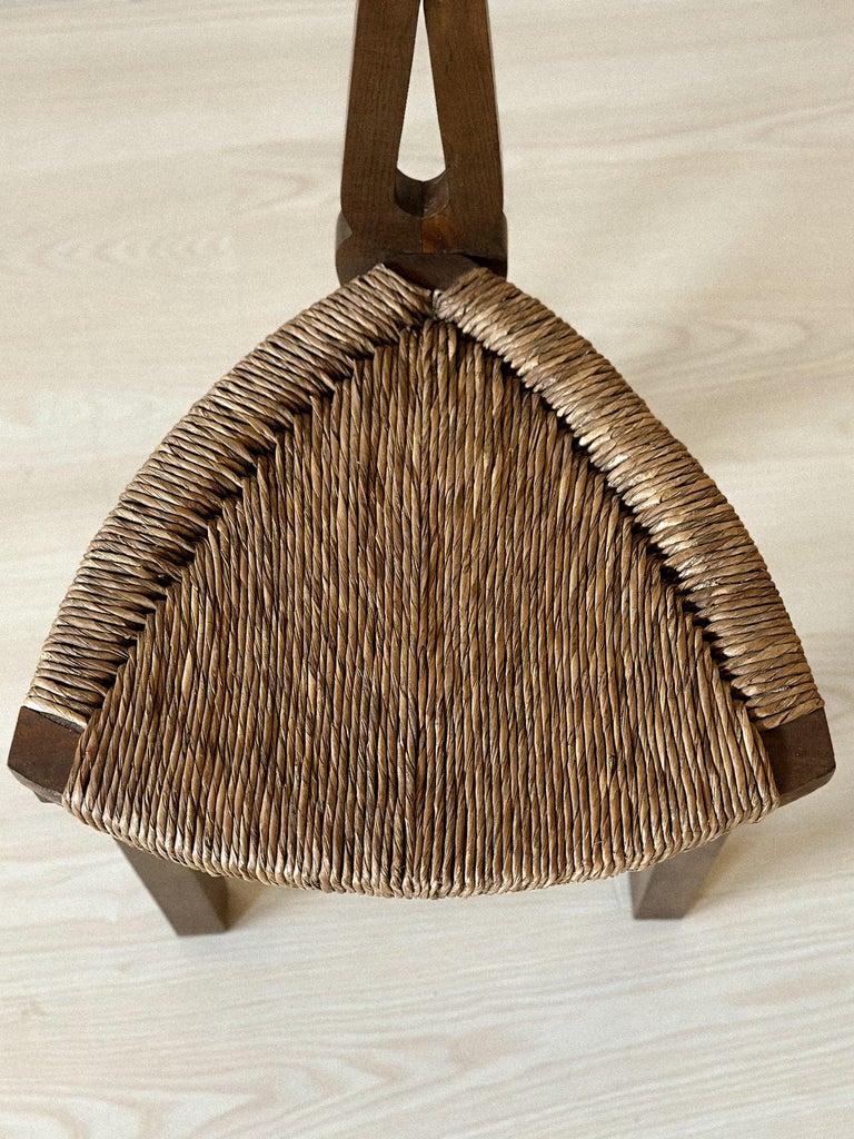 Compact low chairs with wood and rush construction
