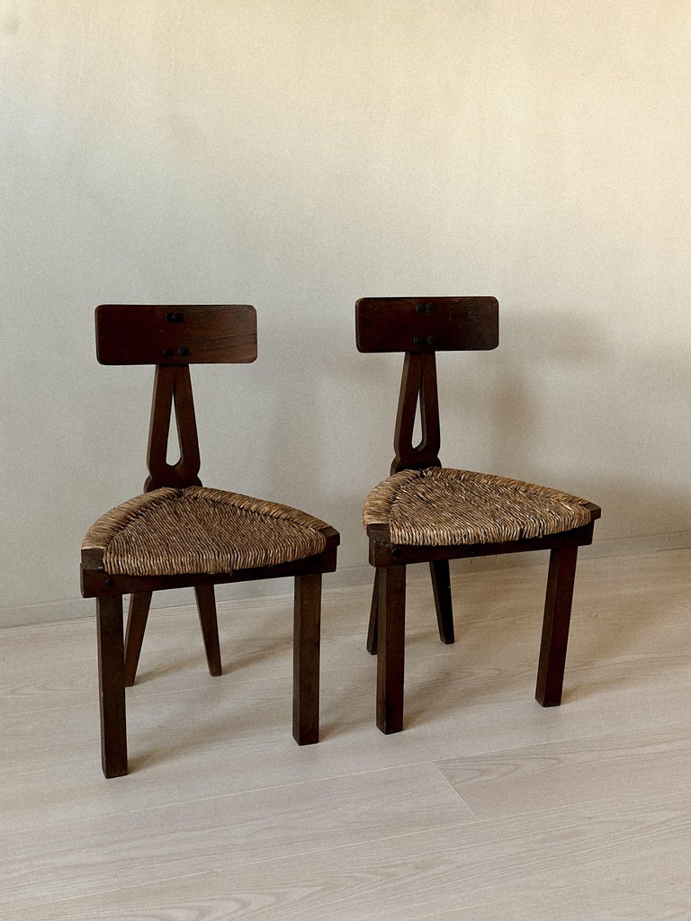 Front view of Spanish low chairs with wooden backs and woven seats