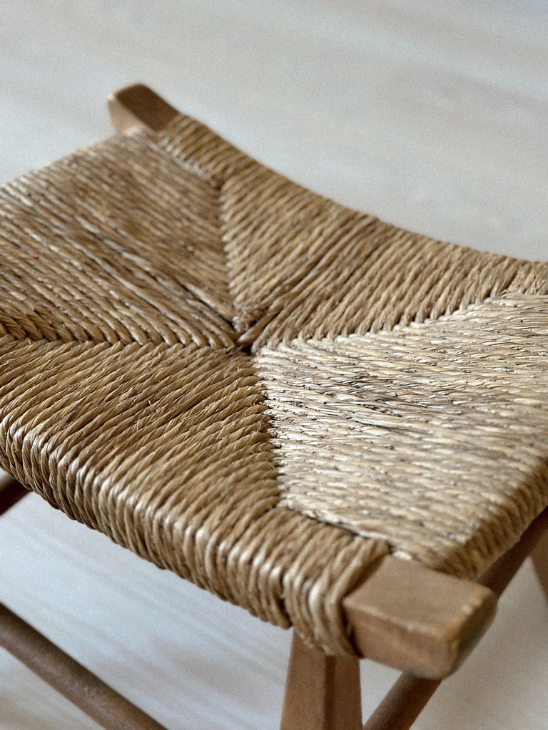 Close-up of woven seat texture on vintage stool