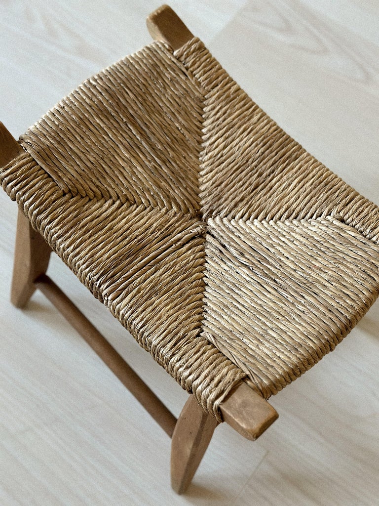 Top view of woven seat on small vintage stool