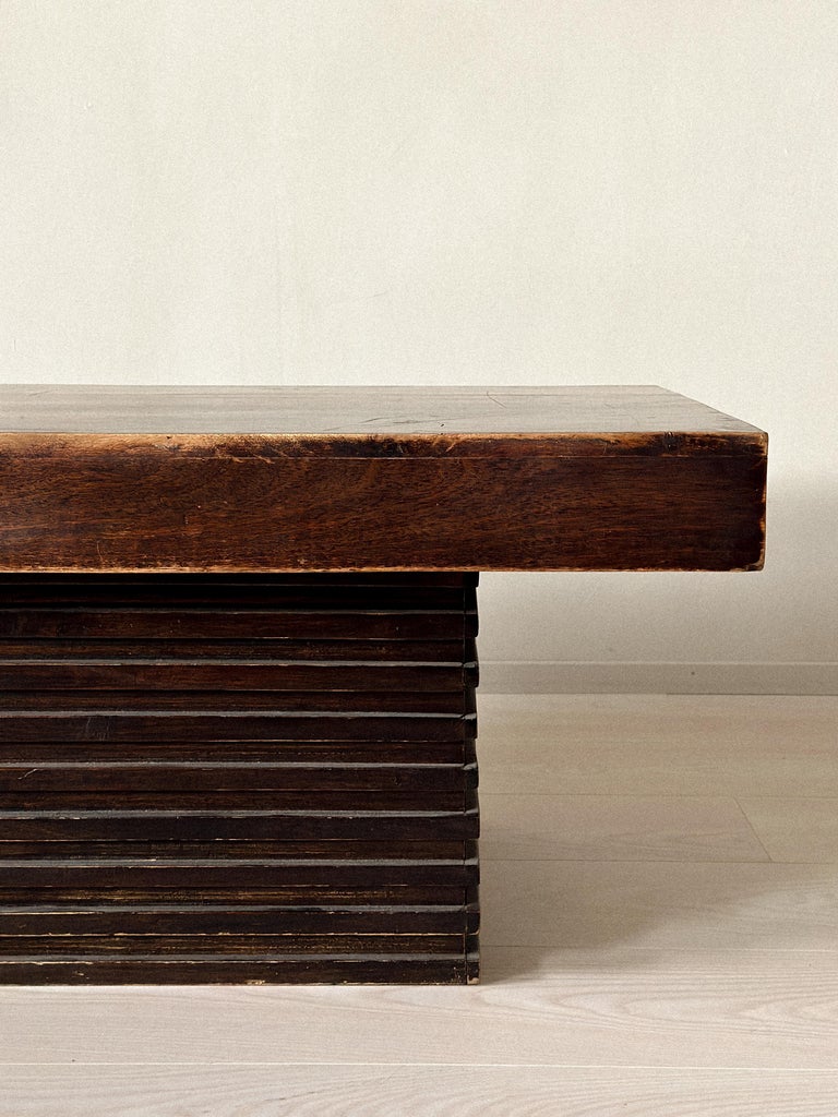 Side profile of Spanish coffee table with architectural base