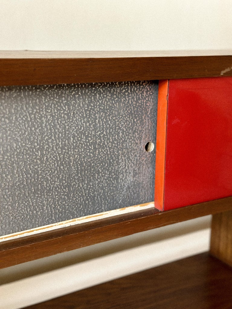 Minimalist mid-century shelf with wooden sliding panels