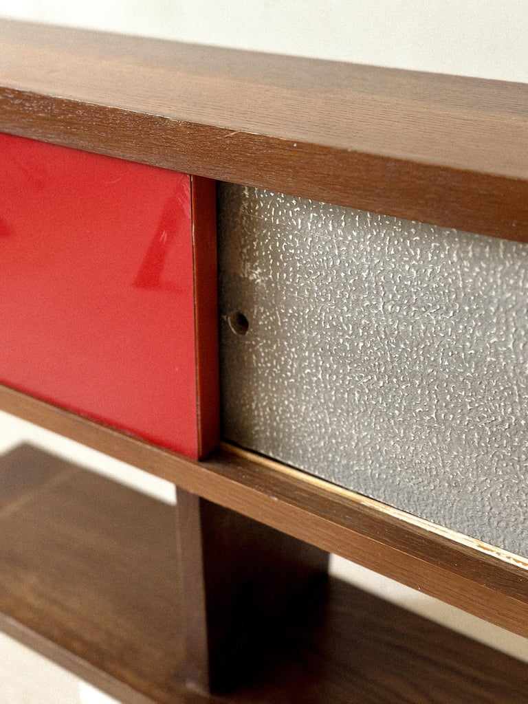 Close-up of sliding door track on vintage French shelf