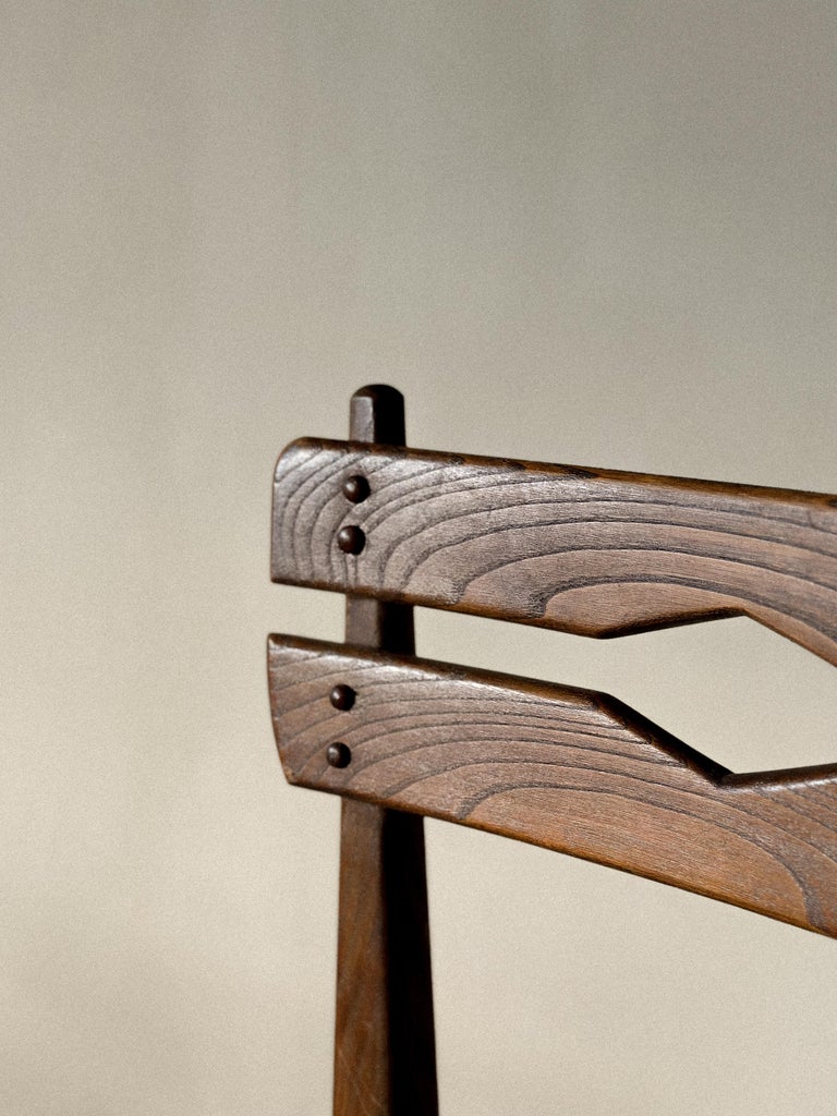 Compact wooden dining chair with neutral seat, mid-century