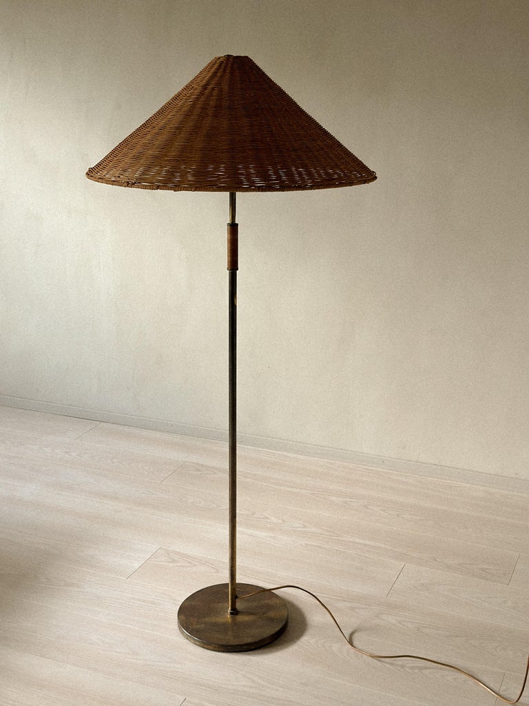 A Mid-Century Floor Lamp in Style of Paavo Tynell, Brass and Rattan, c. 1950s - Image 3